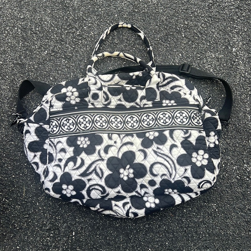 Vera Bradley travel bag with black adjustable crossbody strap